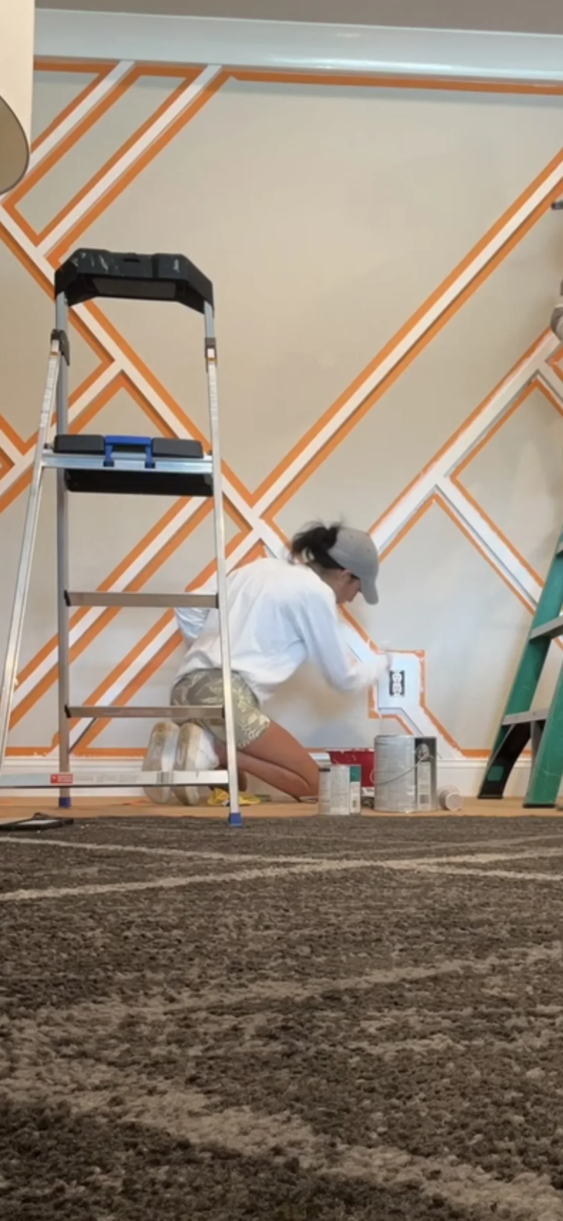 Saddia, owner of Ocean View Home Services, building a custom accent wall